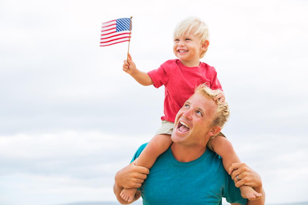 A father and son celebrating the 4th of July in Naples, Florida.