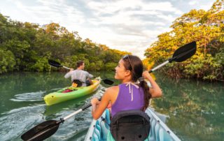 Two people kayaking, one of the best activities in Naples, Florida.