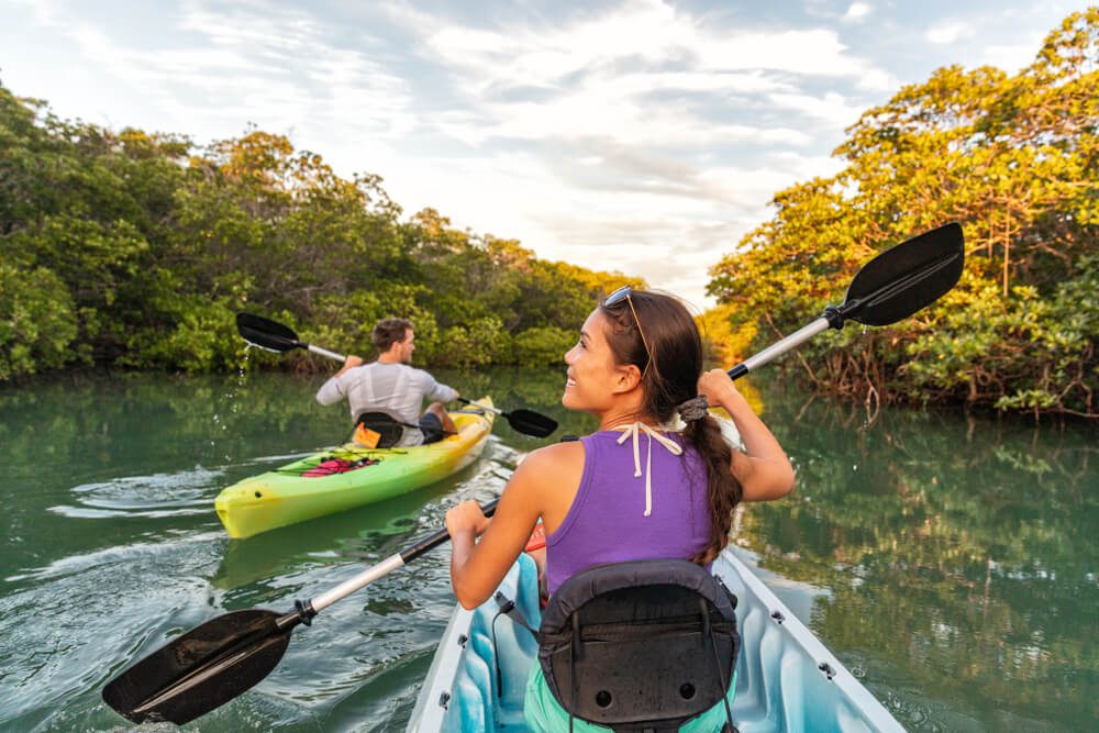 Two people kayaking, one of the best activities in Naples, Florida.