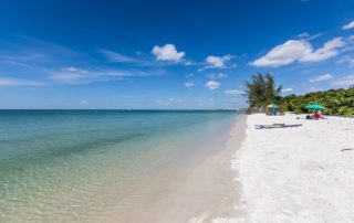 People relaxing at one of the best beaches in Naples, Florida.