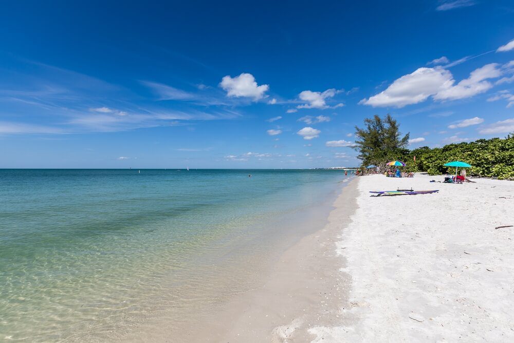 People relaxing at one of the best beaches in Naples, Florida.