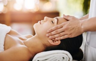 A woman getting a facial, one of the best things to do in Naples on a solo vacation.