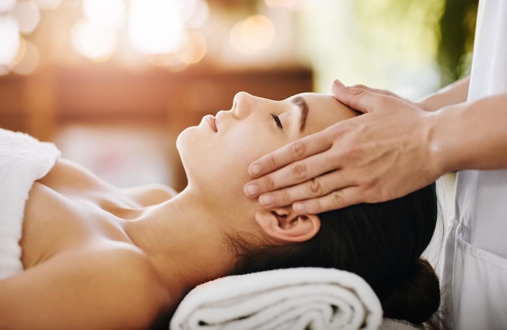 A woman getting a facial, one of the best things to do in Naples on a solo vacation.